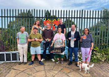 Group standing in front of garden
