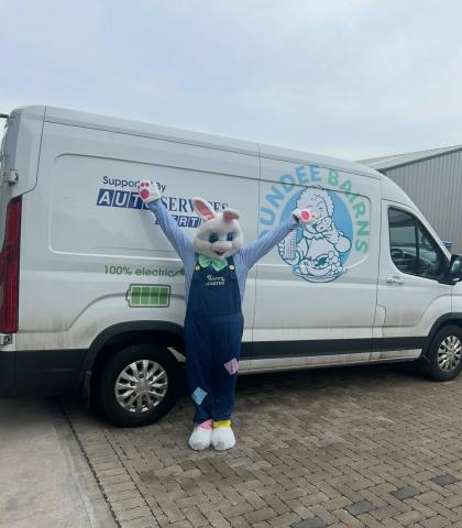 Bunny mascot standing in front of 'Dundee Bairns' van