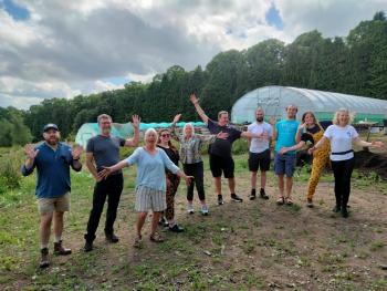 Group standing in front of the garden